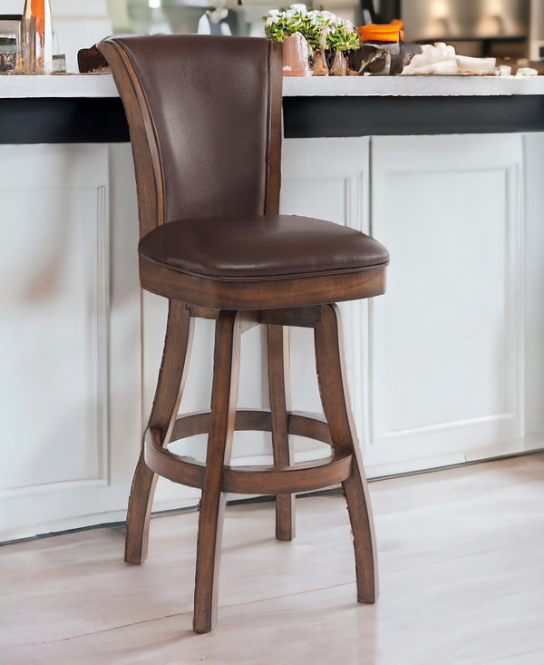 26 Brown And Chestnut Faux Leather And Solid Wood Swivel Counter Height Bar Chair