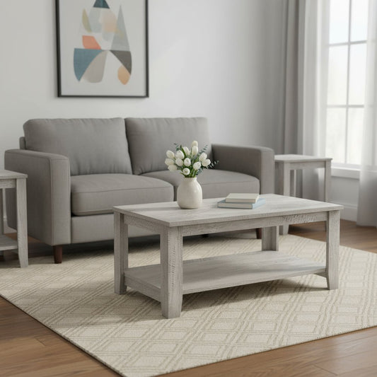 Living room with gray sofa, coffee table, and abstract art on the wall.