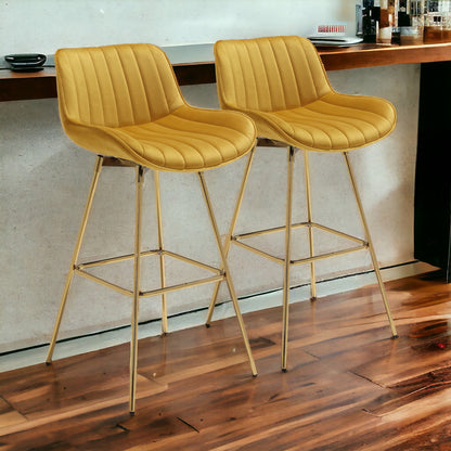 Set of Two 29" Yellow And Gold Velvet And Metal Swivel Low Back Bar Height Bar Chairs