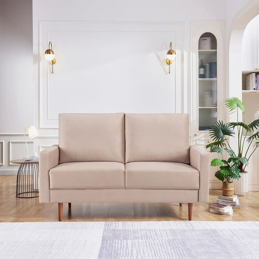 Beige sofa in a modern living room with decor elements.