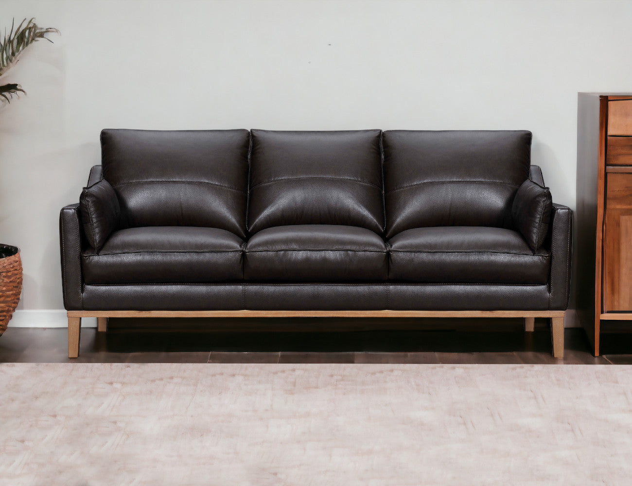 87" Dark Brown Leather Sofa And Toss Pillows With Brown Legs