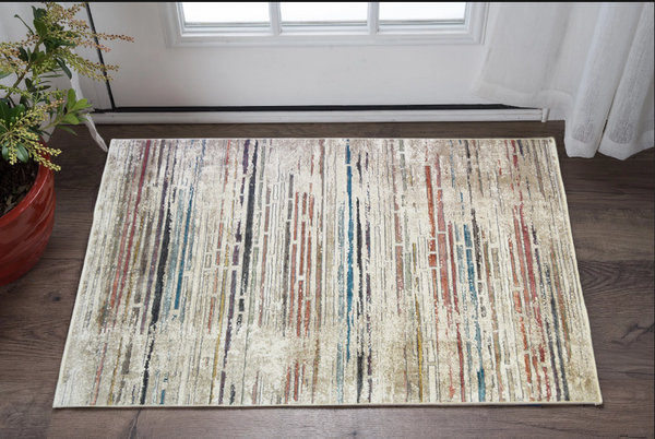 2' x 3' Beige Geometric Distressed Area Rug With Fringe